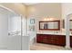 Elegant bathroom with double vanity, soaking tub, and walk-in shower at 21918 N 66Th Ln, Glendale, AZ 85310