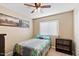 Charming bedroom with ceiling fan and window blinds at 21918 N 66Th Ln, Glendale, AZ 85310