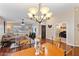 Bright dining room with hardwood floors and view of living room at 21918 N 66Th Ln, Glendale, AZ 85310