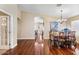 Spacious dining area with hardwood floors and access to kitchen at 21918 N 66Th Ln, Glendale, AZ 85310