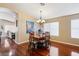 Formal dining room with hardwood floors and a chandelier at 21918 N 66Th Ln, Glendale, AZ 85310