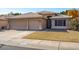 Two-story house with a three-car garage and landscaped yard at 21918 N 66Th Ln, Glendale, AZ 85310