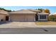 Two-story house with a three-car garage and well-maintained lawn at 21918 N 66Th Ln, Glendale, AZ 85310