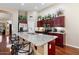 Spacious kitchen with dark wood cabinets and granite countertops at 21918 N 66Th Ln, Glendale, AZ 85310