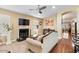 Living room with hardwood floors, fireplace, and comfortable seating at 21918 N 66Th Ln, Glendale, AZ 85310