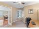 Bright home office with built-in desk and hardwood floors at 21918 N 66Th Ln, Glendale, AZ 85310