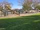 Community playground with play structures and sand area at 21918 N 66Th Ln, Glendale, AZ 85310