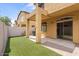 Private backyard with covered patio and artificial turf at 2250 E Deer Valley Rd # 77, Phoenix, AZ 85024