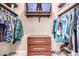 Well-organized walk-in closet with ample shelving and hanging space at 22708 N Kennedy Dr, Maricopa, AZ 85138