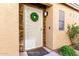 White metal front door with stone accents at 22708 N Kennedy Dr, Maricopa, AZ 85138