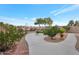 Landscaped backyard with a paved patio and attractive desert plants at 23677 N Desert Dr, Florence, AZ 85132