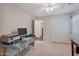 Bedroom with a workspace setup, carpet flooring, and double door closet at 23677 N Desert Dr, Florence, AZ 85132