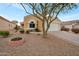 Attractive single-story home with a landscaped front yard and two-car garage at 23677 N Desert Dr, Florence, AZ 85132