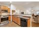 Well-equipped kitchen featuring dark countertops and stainless steel appliances at 23677 N Desert Dr, Florence, AZ 85132