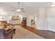 Open living space with a view into the kitchen and a secondary living area at 23677 N Desert Dr, Florence, AZ 85132