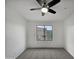 Simple bedroom with carpeted floors and a large window at 2401 E Rio Salado Pkwy # 1038, Tempe, AZ 85288