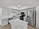 Modern kitchen with stainless steel appliances and white cabinets at 2401 E Rio Salado Pkwy # 1038, Tempe, AZ 85288