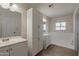 Bathroom with white cabinets and a shower/tub combo at 249 E Grandview St, Mesa, AZ 85201