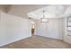 Bright dining room featuring a modern chandelier and light wood flooring at 249 E Grandview St, Mesa, AZ 85201