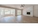 Living room with fireplace, wood-look floors, and access to patio at 249 E Grandview St, Mesa, AZ 85201