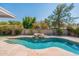 Inviting kidney-shaped pool with a rock waterfall feature at 249 E Grandview St, Mesa, AZ 85201