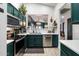 Modern kitchen with dark green cabinets and stainless steel appliances at 2726 S Keene --, Mesa, AZ 85209