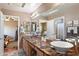 Elegant bathroom with double sinks, marble countertops, and a large mirror at 2769 E Cedar Pl, Chandler, AZ 85249