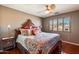 Large bedroom with a king-size bed, wood floors, and beautiful bedding at 2769 E Cedar Pl, Chandler, AZ 85249