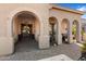 Elegant entryway with arched doorways and a paved patio area at 2769 E Cedar Pl, Chandler, AZ 85249