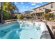 Relaxing hot tub with surrounding stonework and landscaping at 2769 E Cedar Pl, Chandler, AZ 85249