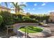 Landscaped circular garden with artificial turf and stone seating at 2769 E Cedar Pl, Chandler, AZ 85249