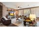 Spacious living room featuring a fireplace and large windows at 2769 E Cedar Pl, Chandler, AZ 85249