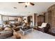 Open living room with stone fireplace and access to kitchen at 2769 E Cedar Pl, Chandler, AZ 85249