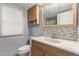 Clean bathroom with light wood vanity and tile backsplash at 2881 W Cactus Wren St, Apache Junction, AZ 85120