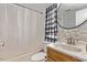 Clean bathroom with tub, vanity, and decorative shower curtain at 2881 W Cactus Wren St, Apache Junction, AZ 85120