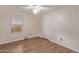 Bedroom with wood-look floors and window coverings at 2881 W Cactus Wren St, Apache Junction, AZ 85120