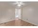 Bright bedroom with wood-look floors and hallway access at 2881 W Cactus Wren St, Apache Junction, AZ 85120