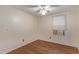 Simple bedroom with wood-look floors and window at 2881 W Cactus Wren St, Apache Junction, AZ 85120