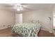 Bedroom with leafy bedding, ceiling fan and laminate wood flooring at 2881 W Cactus Wren St, Apache Junction, AZ 85120