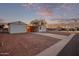 Mobile home with carport and paved driveway, desert landscape in background at 2881 W Cactus Wren St, Apache Junction, AZ 85120