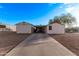 Mobile home with carport and paved driveway, desert landscape in background at 2881 W Cactus Wren St, Apache Junction, AZ 85120