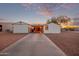 Mobile home with carport and paved driveway, set against a desert landscape at 2881 W Cactus Wren St, Apache Junction, AZ 85120