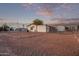 Mobile home exterior with gravel yard and detached garage at 2881 W Cactus Wren St, Apache Junction, AZ 85120