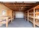 Spacious garage with built-in shelving and workbench at 2881 W Cactus Wren St, Apache Junction, AZ 85120