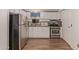 Stainless steel appliances and white cabinets in this kitchen at 2881 W Cactus Wren St, Apache Junction, AZ 85120