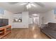 Open living room with hardwood floors, and a view into the kitchen at 2881 W Cactus Wren St, Apache Junction, AZ 85120