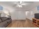 Bright living room with laminate flooring and a ceiling fan at 2881 W Cactus Wren St, Apache Junction, AZ 85120