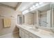 Double sink bathroom vanity with large mirror and shower at 2911 W Lamar Rd, Phoenix, AZ 85017