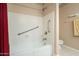 Bathroom features a tub, shower, and safety grab bars at 2911 W Lamar Rd, Phoenix, AZ 85017