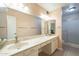 Bathroom with double vanity, large mirror, and shower at 2911 W Lamar Rd, Phoenix, AZ 85017